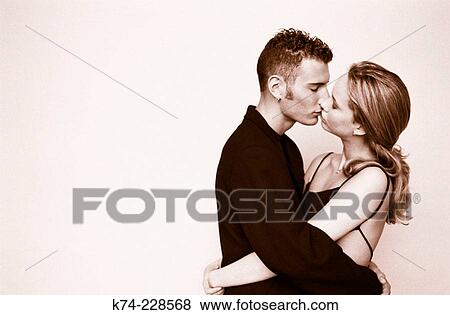 image of young couple kissing View Large Photo Image Stock Photo - image of young couple kissing. Fotosearch
