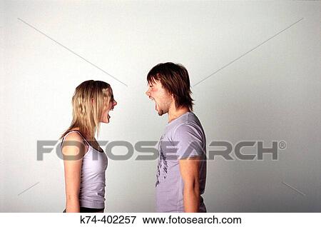 image of young couple screaming at each other View Large Photo Image Stock Photo - image of young couple screaming at each other. Fotosearch
