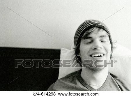 image of young man, laughing, eyes closed View Large Photo Image Stock Photo - image of young man, laughing, eyes closed. Fotosearch