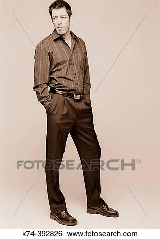Image of young man looking at viewer View Large Photo Image Stock Photograph - Image of young man looking at viewer. Fotosearch