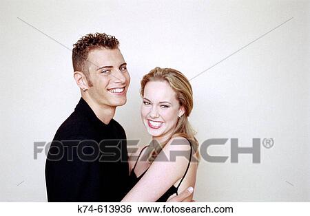 Stock Photograph - image of young smiling couple. Fotosearch