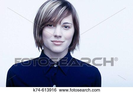 Stock Photograph - Image of young woman smiling at viewer. Fotosearch