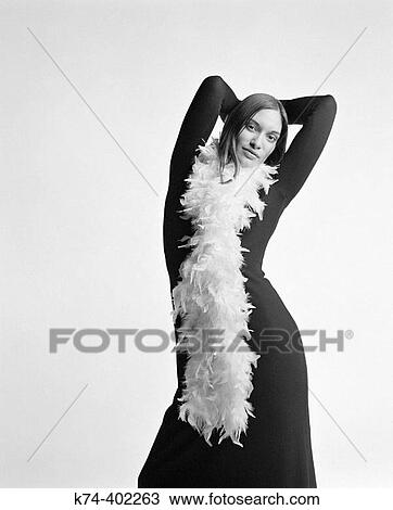 Stock Image - image of young woman with feather boa. Fotosearch