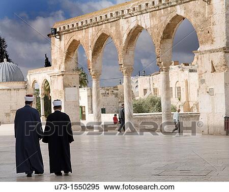 Imams walk out of the Al Aqsa mosque on the Temple mount in the old city of Jerusalem View Large Photo Image Stock Photography - Imams walk out of the Al Aqsa mosque on the Temple mount in the old city of Jerusalem. Fotosearch