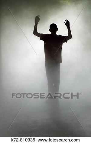 In a dreamy mist this young man is dreaming he is a hero View Large Photo Image Stock Photograph - In a dreamy mist this young man is dreaming he is a hero. Fotosearch