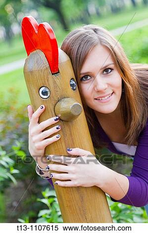 In company with a wooden playground dolly View Large Photo Image Stock Photography - In company with a wooden playground dolly. Fotosearch