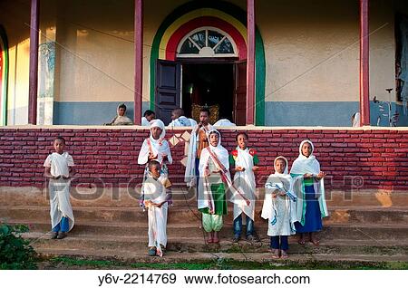 Stock Photo - In front of a orthodox church, children are singing. Oromia state, Ethiopia.. Fotosearch