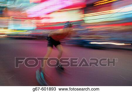 Stock Image - In-line skating at Times Square. New York City. USA. Fotosearch