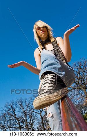 In park with dirty sneakers and hands spread View Large Photo Image Stock Photography - In park with dirty sneakers and hands spread. Fotosearch