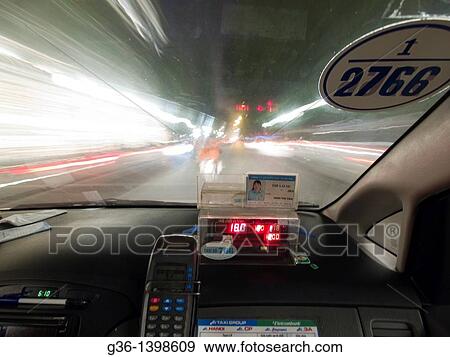 Stock Photo - In side speeding taxi in Hanoi, Vietnam. Fotosearch