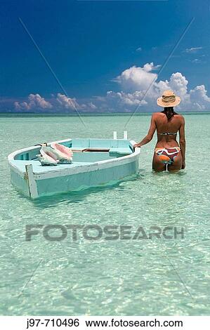 In the pristine sandy shallows of Alabaster Bay, you can walk along the bottom and look for empty conch shells the locals have discarded ater removing the conch, Eleuthera, Bahamas, Atlantic Ocean. View Large Photo Image Stock Photograph - In the pristine sandy shallows of Alabaster Bay, you can walk along the bottom and look for empty conch shells the locals have discarded ater removing the conch, Eleuthera, Bahamas, Atlantic Ocean.. Fotosearch