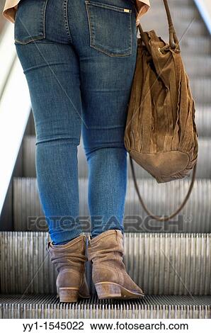 In the Rotterdam shopping-mall? De Bijenkorf?, female shoppers use the escalators to transport themselves between the many floors of the Mall. View Large Photo Image Stock Image - In the Rotterdam shopping-mall? De Bijenkorf?, female shoppers use the escalators to transport themselves between the many floors of the Mall.. Fotosearch
