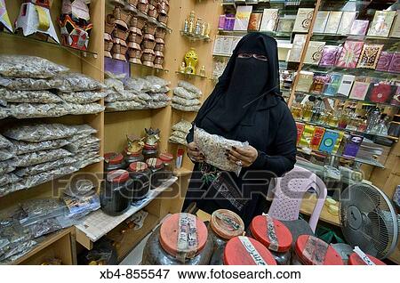 Stock Photo - Incense dealer at market, Salalah, Oman. Fotosearch
