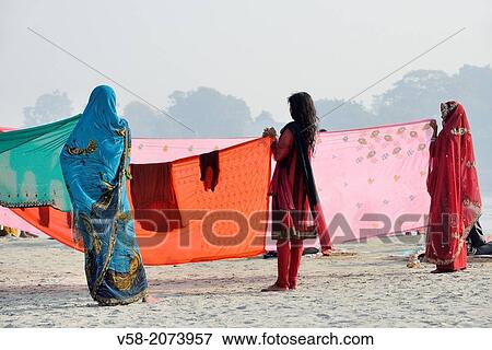 India, Bihar, Sonepur, Women drying sarees on the banks of the Ganges. View Large Photo Image Stock Photo - India, Bihar, Sonepur, Women drying sarees on the banks of the Ganges.. Fotosearch
