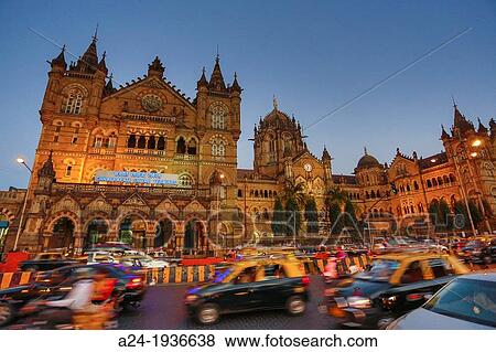 Stock Photo - India, Maharastra State, Mumbay City, Dadabhai Naoroji Road and Victoria Station (Chatrapati Shivaji Terminal), Sunset. Fotosearch