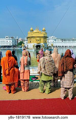 India. Punjab. Amritsar. The Golden Temple. Believers Sikh in front of the sacred pool Anrit Sarovar and the Sri Harmandir Sahib the holy of holies of Sikhism. View Large Photo Image Stock Photo - India. Punjab. Amritsar. The Golden Temple. Believers Sikh in front of the sacred pool Anrit Sarovar and the Sri Harmandir Sahib the holy of holies of Sikhism.. Fotosearch