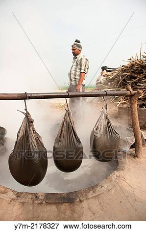India: Punjab: Sugar production from Sugar Cane View Large Photo Image Stock Photo - India: Punjab: Sugar production from Sugar Cane. Fotosearch