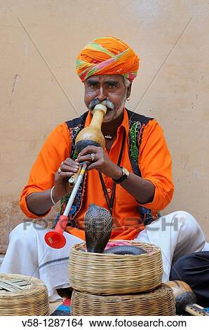 Picture - India, Rajasthan, Amber fort, Snake charmer. Fotosearch
