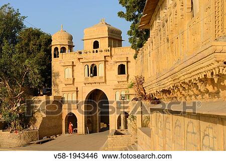 Stock Photograph - India, Rajasthan, Jaisalmer, Gadi Sagar tank, Tilon ki Pol gate.. Fotosearch
