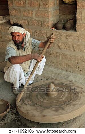 India, Rajasthan, Jodhpur, potter turning wheel, View Large Photo Image Stock Photography - India, Rajasthan, Jodhpur, potter turning wheel,. Fotosearch
