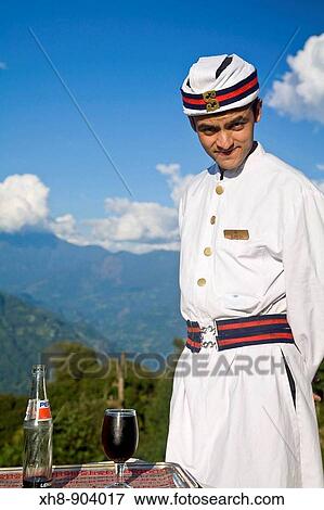 Stock Photo - India, Sikkim, Pelling, Elgin Mount Pandim Hotel, Waiter. Fotosearch