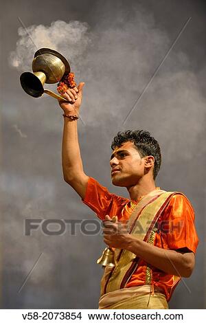 Picture - India, Uttar Pradesh, Varanasi, Aarti, Offering of incense to the Ganges.. Fotosearch