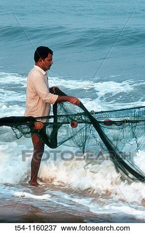 Indian fishermen on the Malabar coast View Large Photo Image Stock Photo - Indian fishermen on the Malabar coast. Fotosearch