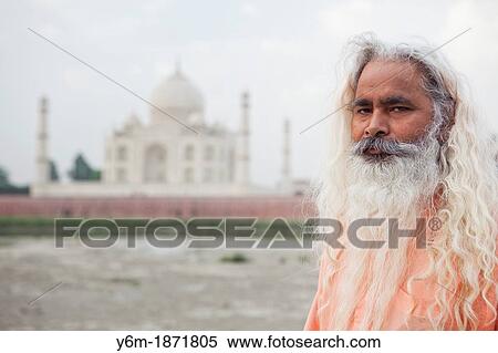 Stock Photography - Indian Holy Man In Front Of Taj Mahal, Agra, Uttar Pradesh, India. Fotosearch