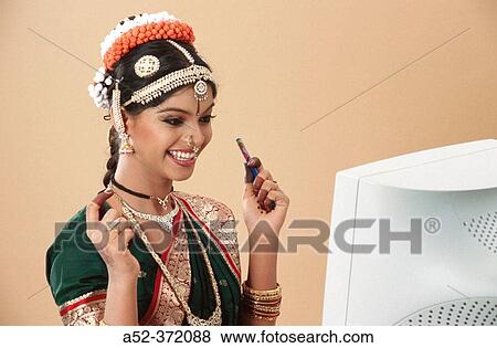 Stock Photo - Indian lady with computer. Fotosearch