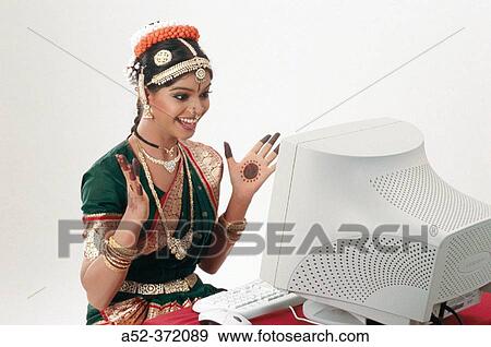 Stock Photo - Indian lady with computer. Fotosearch