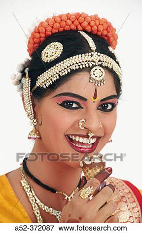 Stock Photo - Indian lady with cone. Fotosearch
