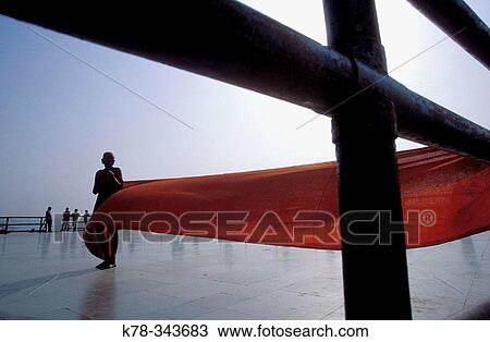 Indian woman drying a sari in the air. Varanasi, India View Large Photo Image Stock Image - Indian woman drying a sari in the air. Varanasi, India. Fotosearch