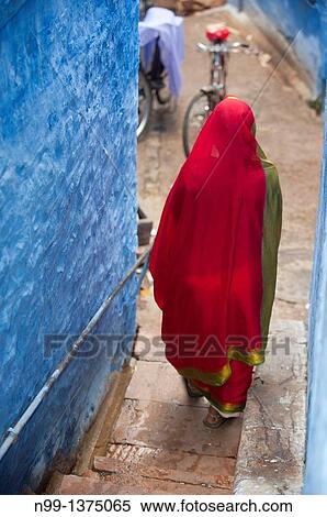 Indian Woman walking in narrow street, Blue city, Jodhpur, Rajasthan, India View Large Photo Image Stock Photography - Indian Woman walking in narrow street, Blue city, Jodhpur, Rajasthan, India. Fotosearch
