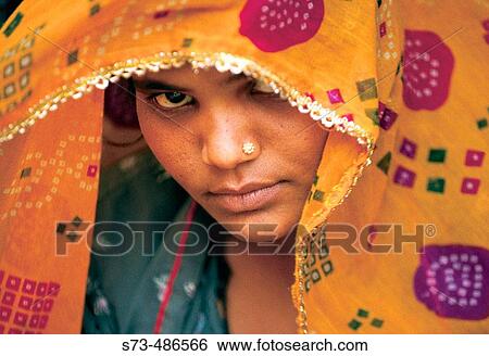 Stock Photograph - Indian woman's face, wearing a sari. New Delhi. India.. Fotosearch