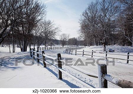 Stock Photograph - Indianapolis, Indiana - A snow-covered road in a park on the edge of the city. Fotosearch