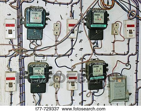 Individual electricity switches, meters and fuse boxes for several properties Pune, Maharashtra, India View Large Photo Image Stock Photo - Individual electricity switches, meters and fuse boxes for several properties Pune, Maharashtra, India. Fotosearch