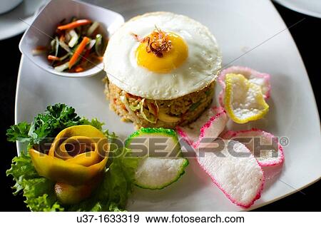 Indonesian fried rice, Seminyak Road, Bali, Indonesia View Large Photo Image Stock Photo - Indonesian fried rice, Seminyak Road, Bali, Indonesia. Fotosearch