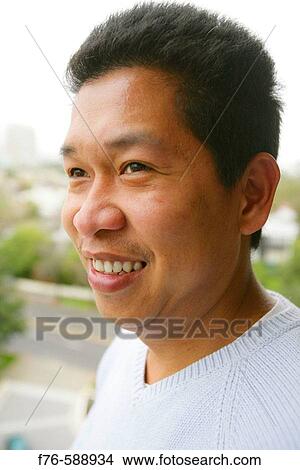 Indonesian man in his mid-20s View Large Photo Image Picture - Indonesian man in his mid-20s. Fotosearch