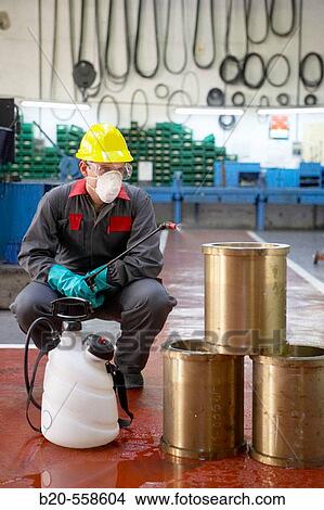 Industrial cleaning with spray, degreasing bronze bushes. Guipuzcoa, Euskadi, Spain View Large Photo Image Picture - Industrial cleaning with spray, degreasing bronze bushes. Guipuzcoa, Euskadi, Spain. Fotosearch