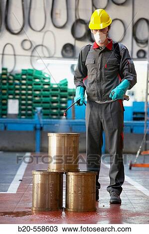 Industrial cleaning with spray, degreasing bronze bushes. Guipuzcoa, Euskadi, Spain View Large Photo Image Stock Image - Industrial cleaning with spray, degreasing bronze bushes. Guipuzcoa, Euskadi, Spain. Fotosearch