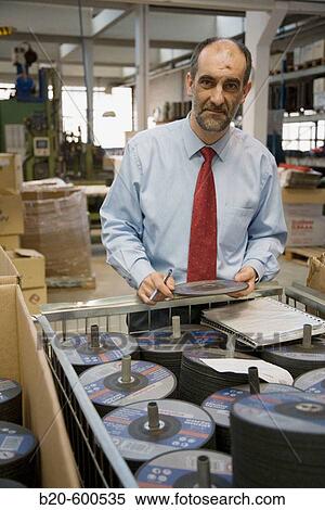 Stock Photography - Industrial director. Abrasive discs manufacture.. Fotosearch