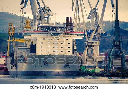 Stock Image - Industry and ship Nervion river Biscay Basque Country, Spain. Fotosearch