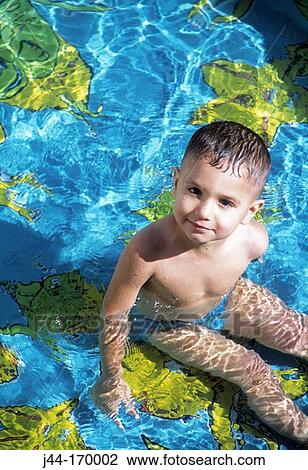 Stock Image - Infant boy in a pool. Fotosearch