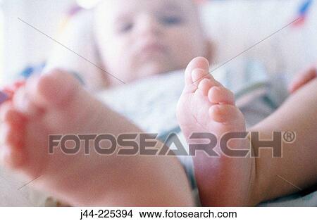 Infant boy's feet View Large Photo Image Picture - Infant boy's feet. Fotosearch