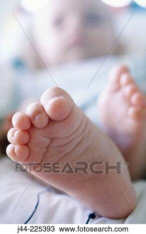 Stock Image - Infant boy's feet. Fotosearch