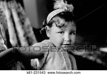 Stock Image - infant dressed up for carnival. Fotosearch