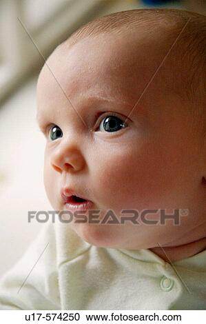 Infant girl looking off to the side. View Large Photo Image Stock Image - Infant girl looking off to the side.. Fotosearch