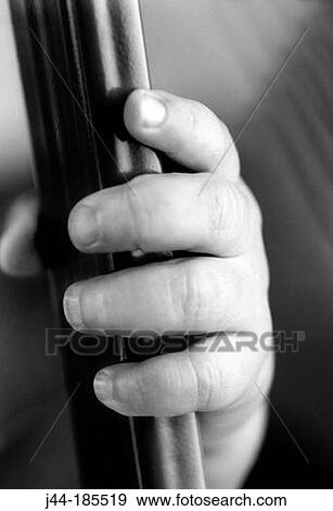 Stock Photo - Infant hand on rail. Fotosearch