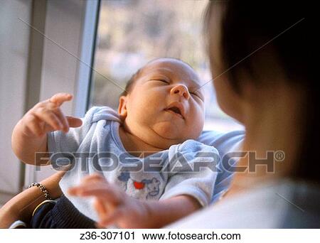 Infant with mother View Large Photo Image Stock Image - Infant with mother. Fotosearch