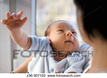 Infant with mother View Large Photo Image Stock Image - Infant with mother. Fotosearch